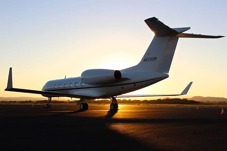 Business jet on the apron at sunset